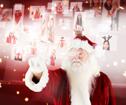 Composite image of santa pointing to christmas people collage