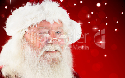 Composite image of santa claus winking