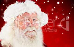 Composite image of santa claus winking