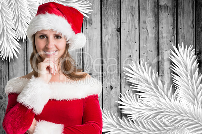 Composite image of pretty girl in santa outfit