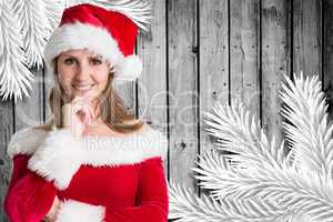 Composite image of pretty girl in santa outfit