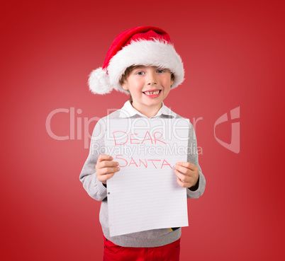 Composite image of festive boy showing letter