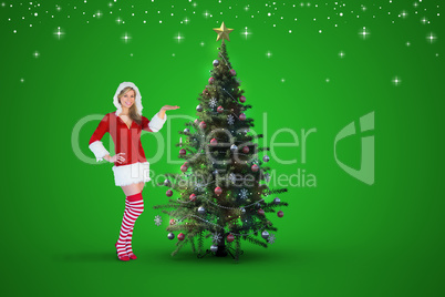 Composite image of pretty girl presenting in santa outfit