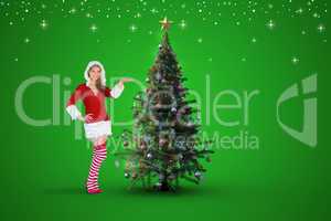 Composite image of pretty girl presenting in santa outfit