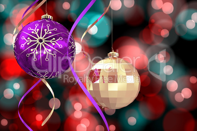 Composite image of hanging christmas bauble decorations