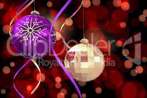 Composite image of hanging christmas bauble decorations