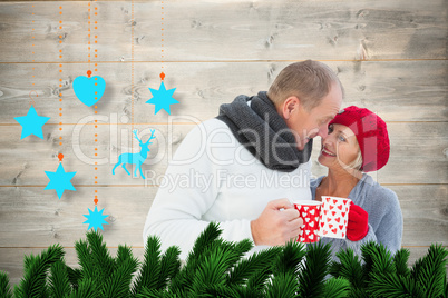 Composite image of mature couple holding mugs