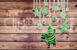 Composite image of hanging christmas decorations