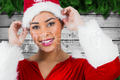 Composite image of pretty santa girl