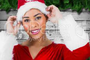 Composite image of pretty santa girl