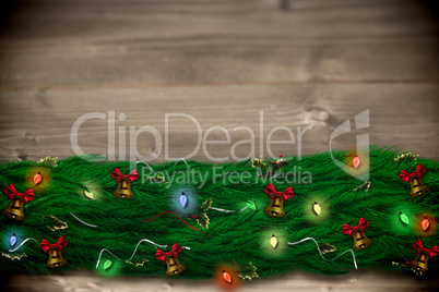 Composite image of fir branch christmas decoration garland