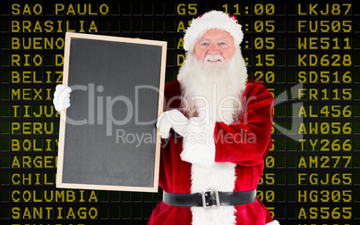 Composite image of santa claus showing blackboard