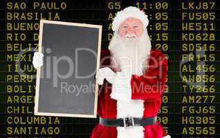 Composite image of santa claus showing blackboard