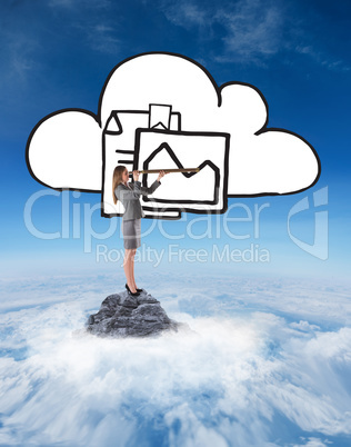 Composite image of businesswoman looking through a telescope