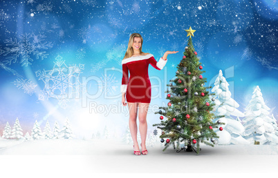 Composite image of pretty girl presenting in santa outfit