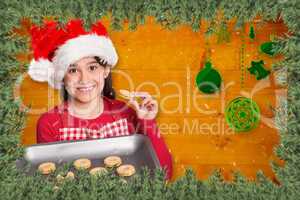 Composite image of festive little girl offering cookies