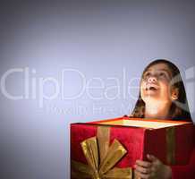 Composite image of happy girl opening gift box