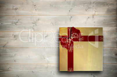 Composite image of christmas present with bow