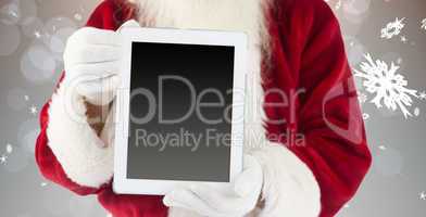 Composite image of santa claus showing tablet pc