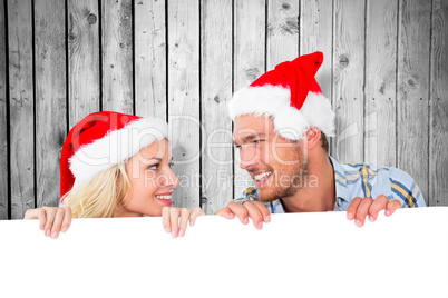 Composite image of young festive couple