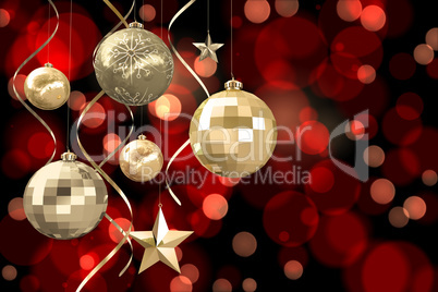 Composite image of hanging christmas bauble decorations