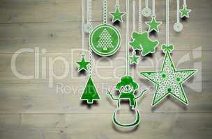 Composite image of hanging christmas decorations