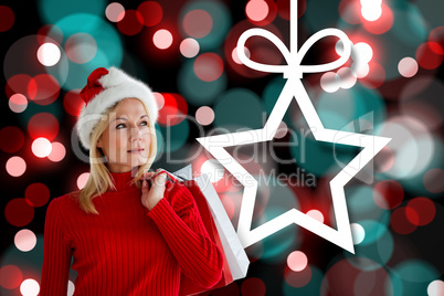 Composite image of happy festive blonde with shopping bags