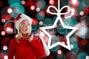 Composite image of happy festive blonde with shopping bags