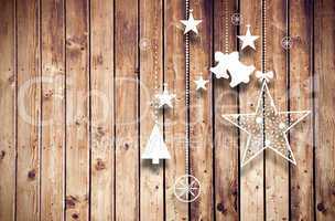 Composite image of hanging christmas decorations