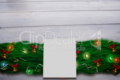 Composite image of fir branch christmas decoration garland