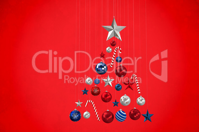 Composite image of christmas tree shape of baubles