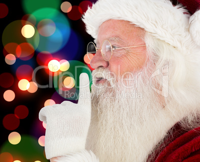 Composite image of santa claus making quiet sign