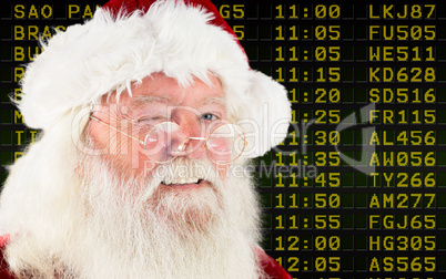 Composite image of santa claus winking