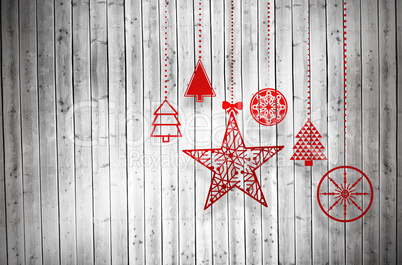 Composite image of hanging red christmas decorations