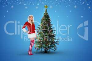 Composite image of pretty girl smiling in santa outfit