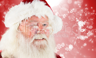 Composite image of santa claus winking