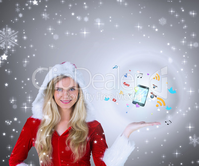 Composite image of pretty girl presenting in santa outfit