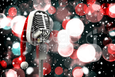 Composite image of microphone with santa hat