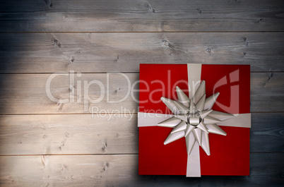 Composite image of christmas present with bow