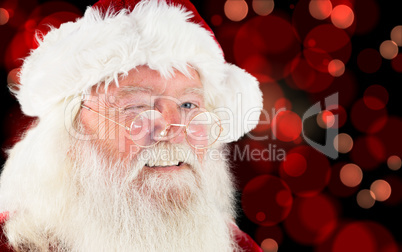 Composite image of santa claus winking