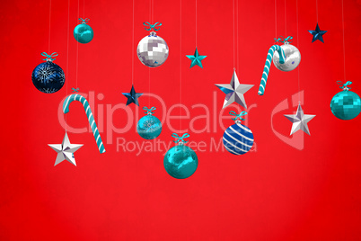 Composite image of digitally generated hanging christmas decorat