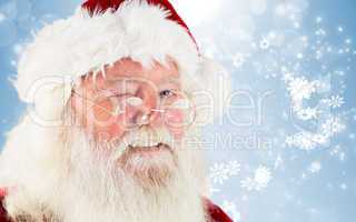 Composite image of santa claus winking