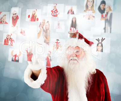 Composite image of santa pointing to christmas people collage