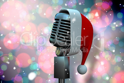 Composite image of microphone with santa hat