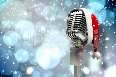 Composite image of microphone with santa hat