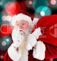 Composite image of santa claus carrying sack