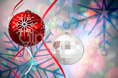 Composite image of hanging christmas bauble decorations