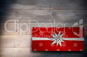 Composite image of christmas present with bow
