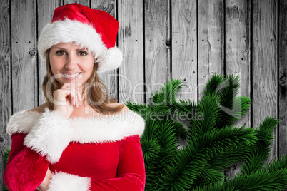 Composite image of pretty girl in santa outfit