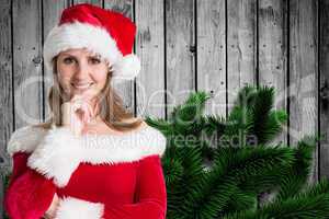 Composite image of pretty girl in santa outfit